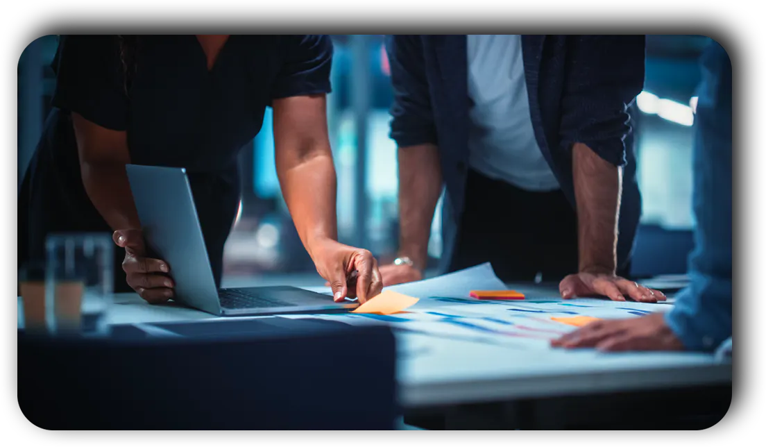 Business partners reviewing a plan at the work table