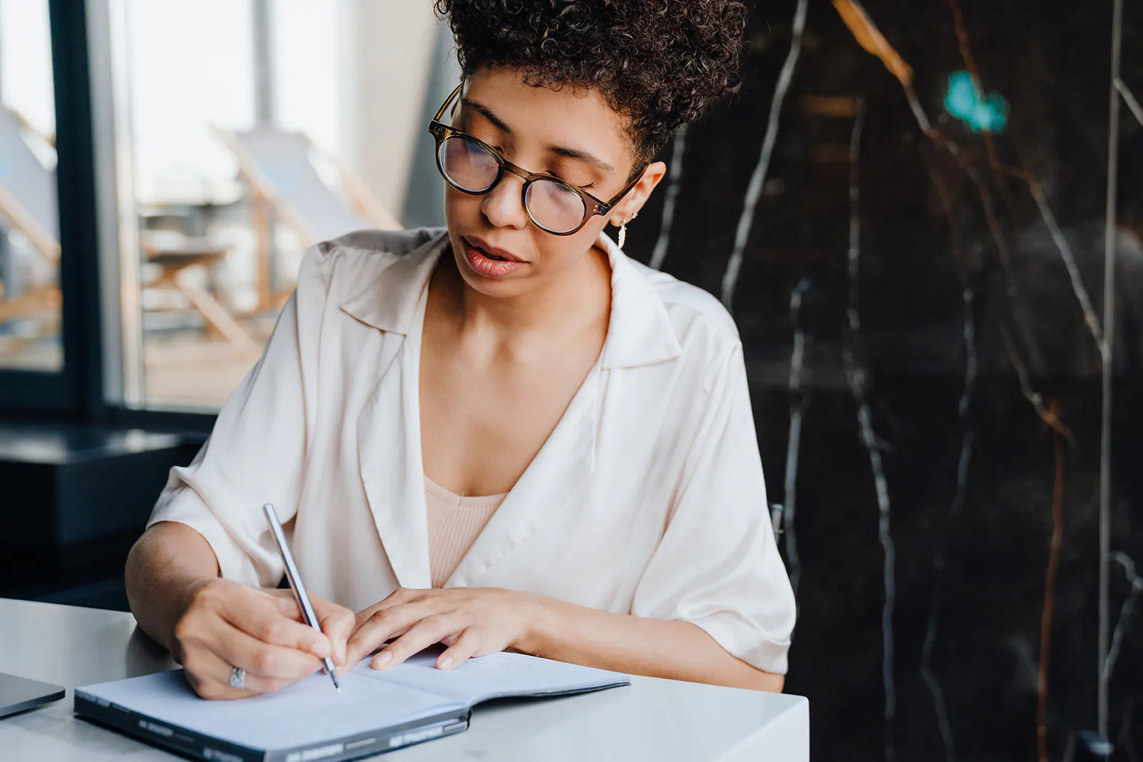 worker taking notes in her planner