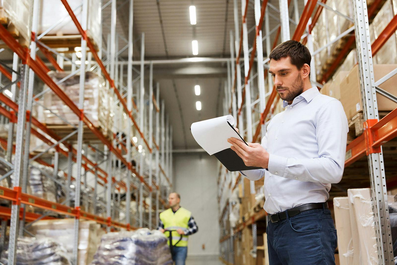 warehouse supervisor reviewing a report