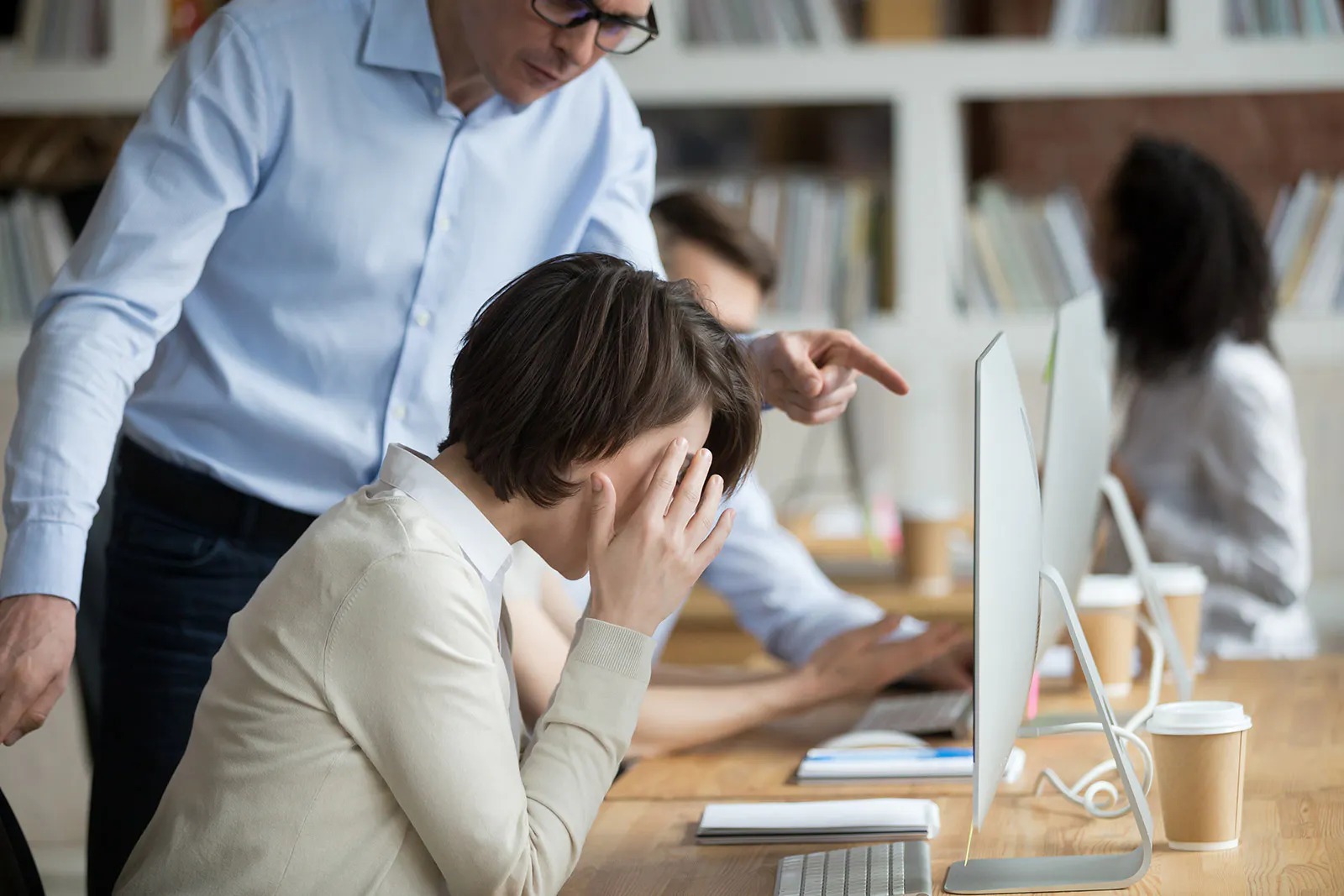 executive verbally calls the employee's attention in the office.